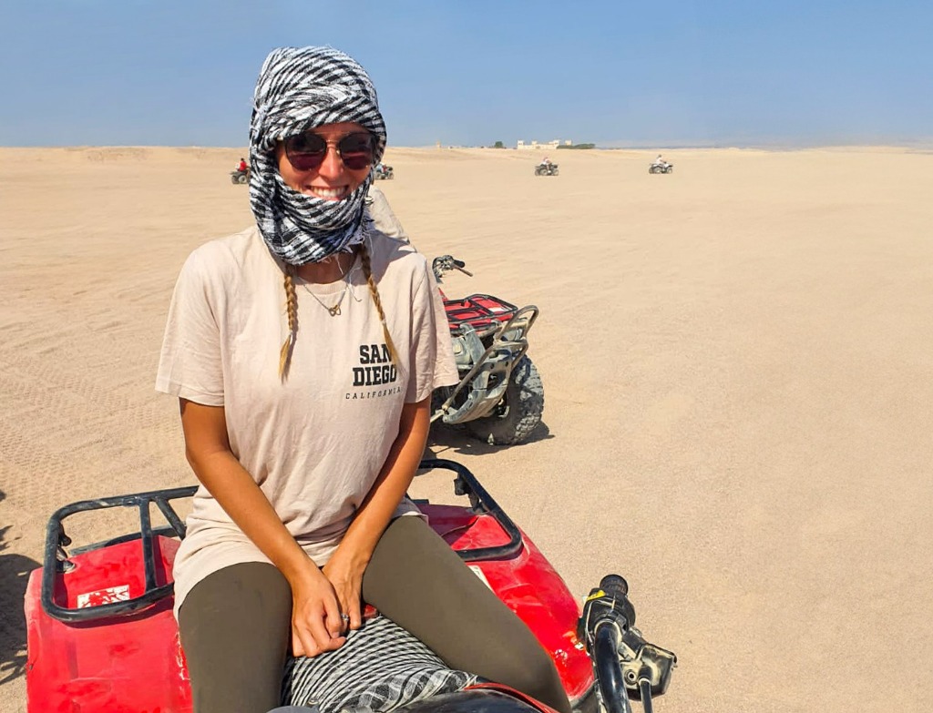 Gina on quad in the desert